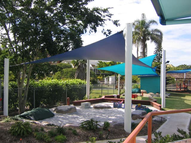 A shade structure covering a playground